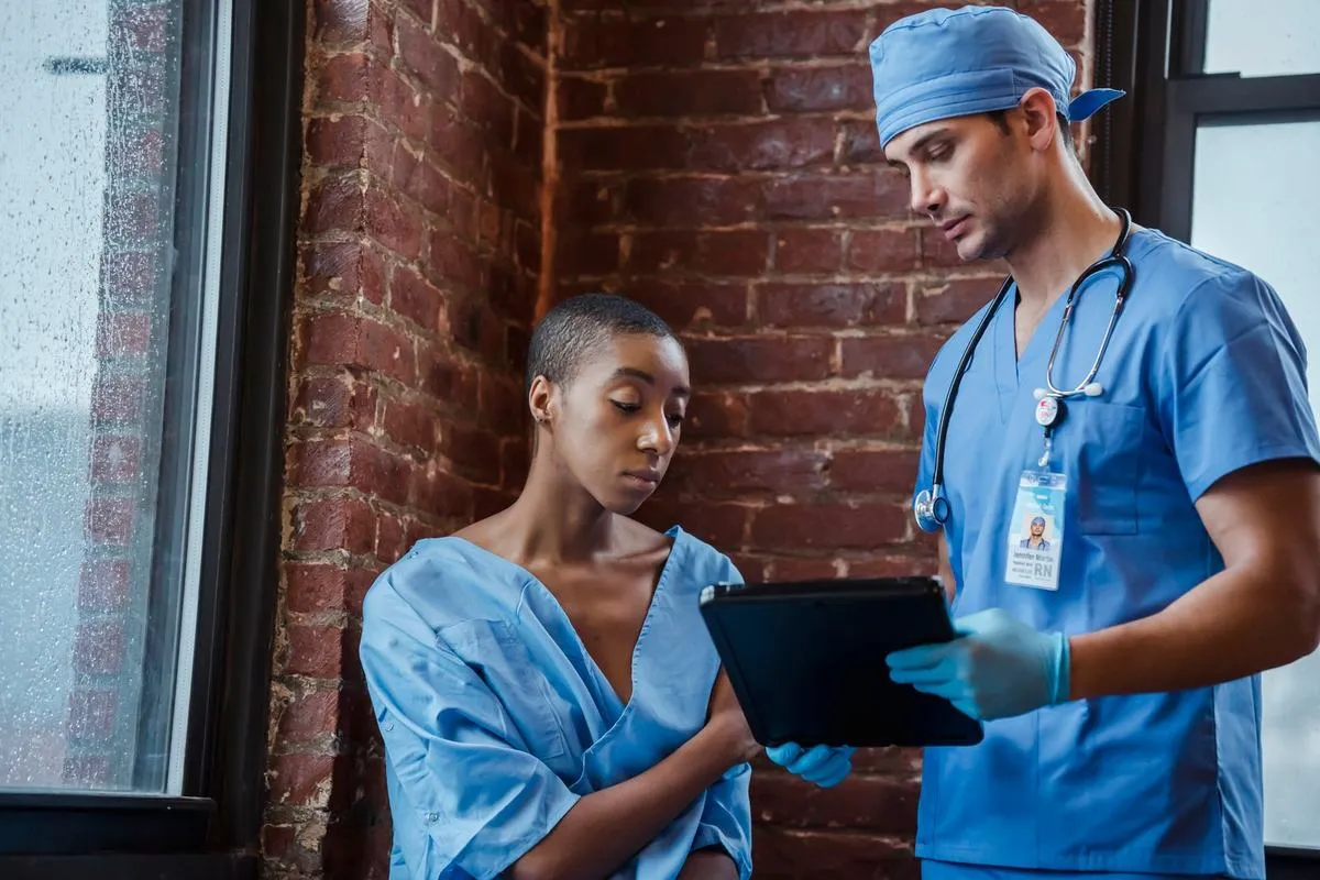 A doctor and a patient looking at a tablet