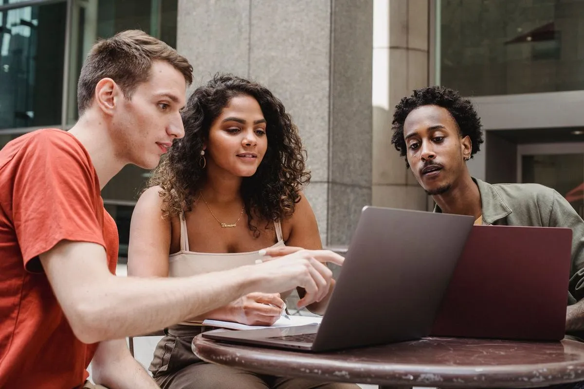 Young founders working at laptops